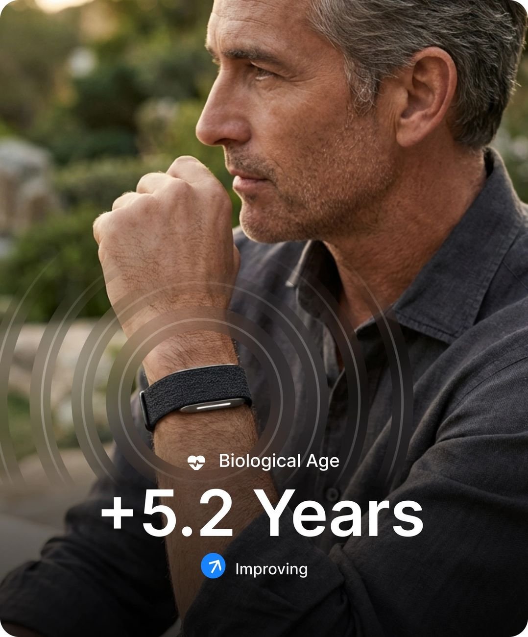Man wearing Hume Band, biological age and illness risk visible on screen